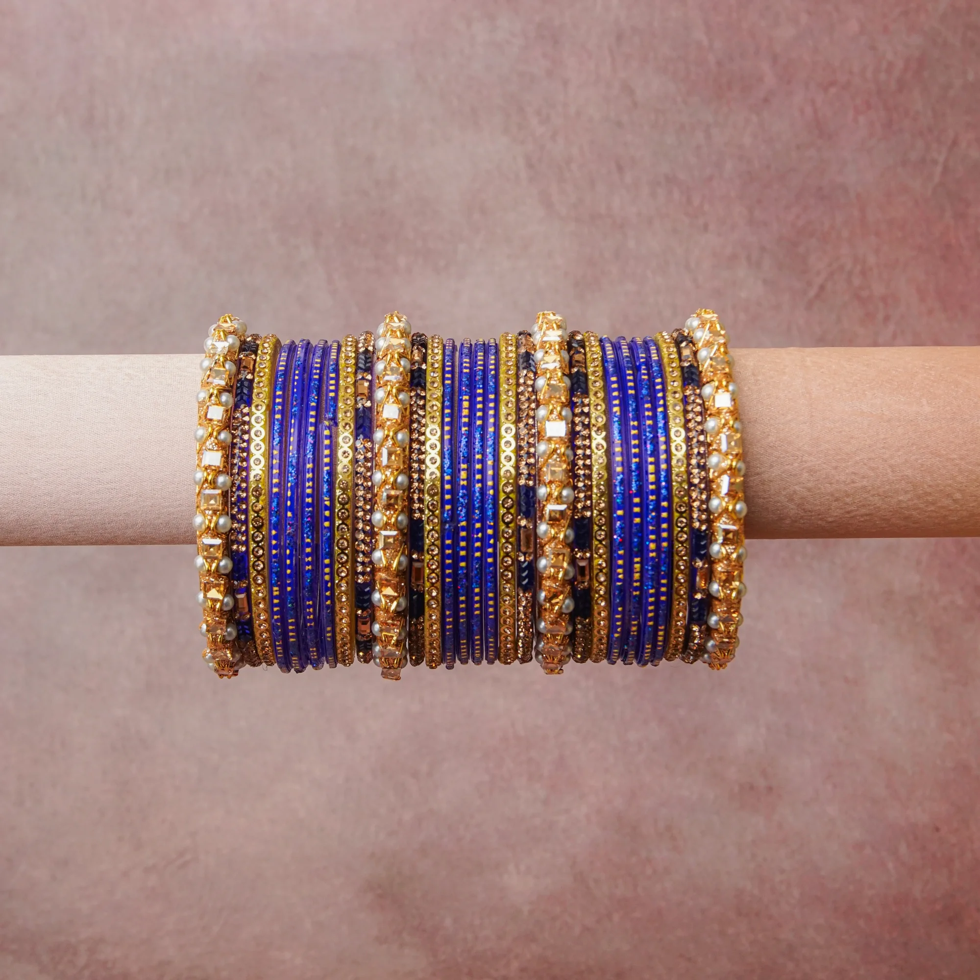 A grounding Cobalt Blue forms the heart of the set, while touches of Gold, Bronze, Cream, Clear, Midnight Blue add charm.

A thoughtful composition of Glass, Metal, Pearl, Crystal, designed to feel complete without being heavy.
Each element layers seamlessly, creating a look that is refined, wearable and quietly striking.